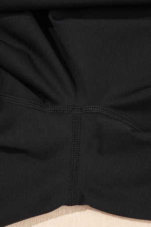 Black Sleeveless Knot Skirt Hem Sports Romper